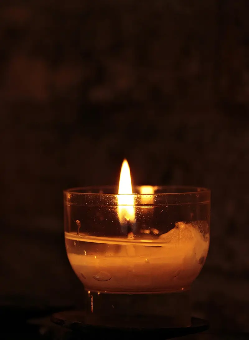 Candle glowing in a quiet sanctuary